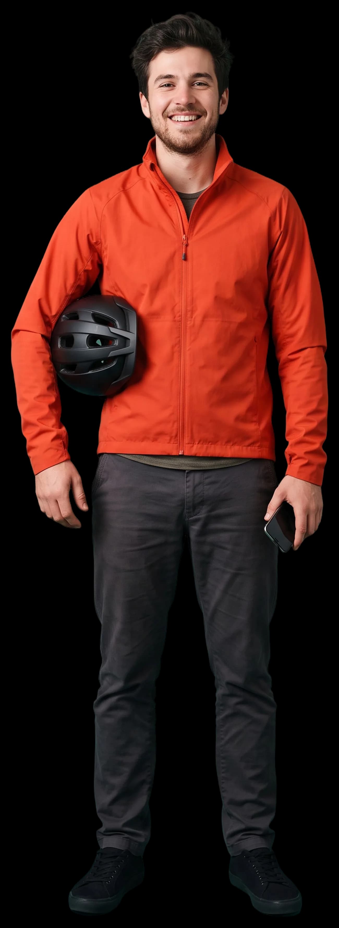 A young man with a bicycle helmet grinning at the camera, phone in hand