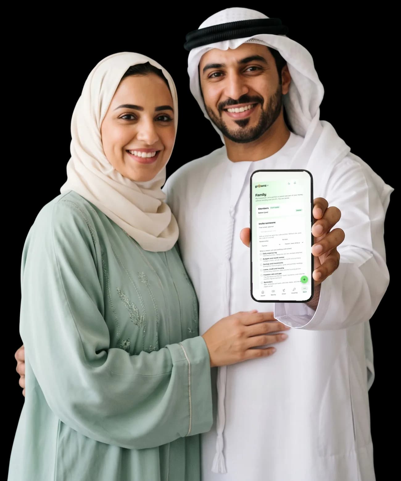 A couple in a hijab and a kandura holding one phone up to the camera with the Family screen showing