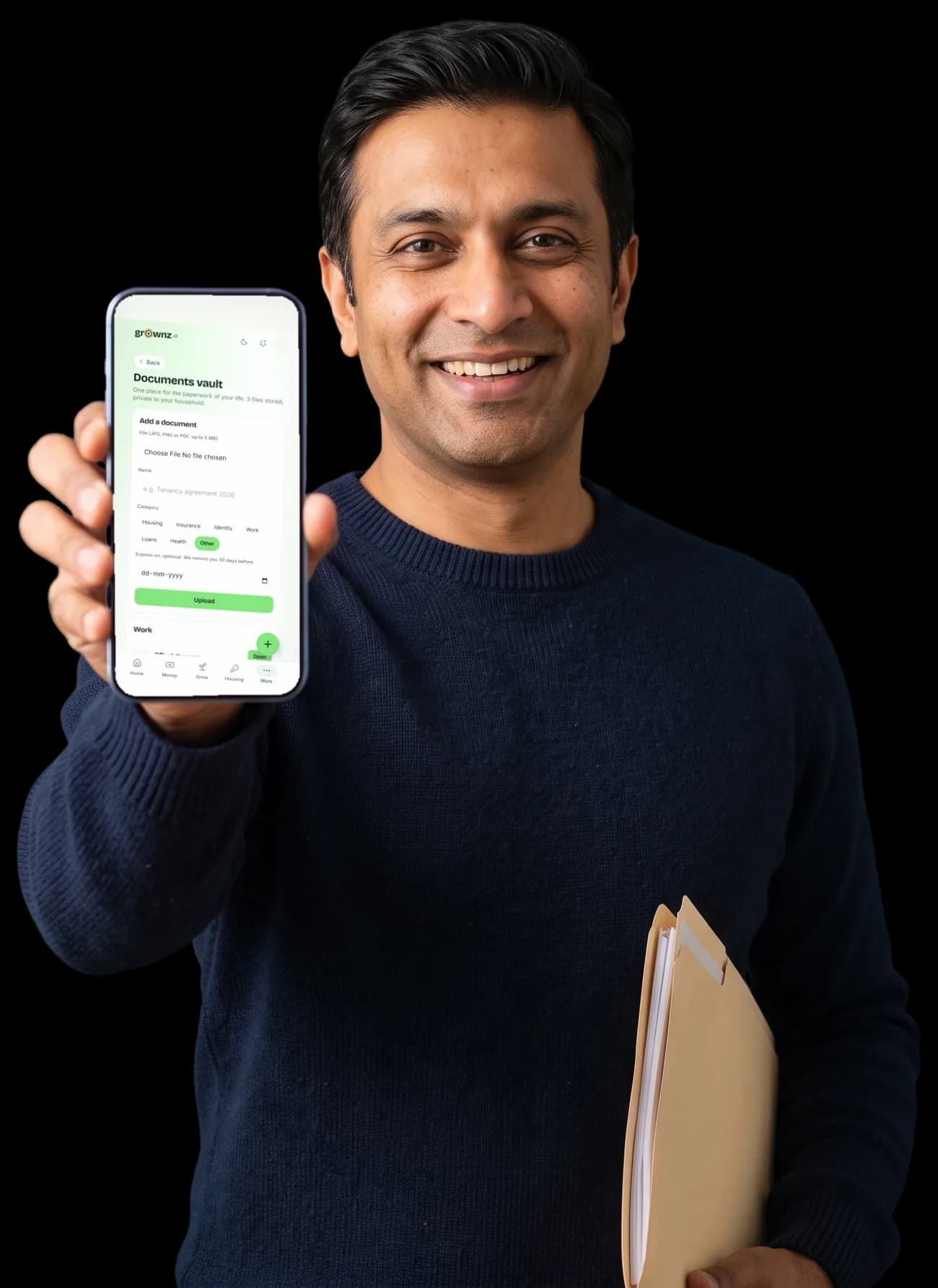 A man with a folder of documents holding his phone up to the camera, the Documents vault showing