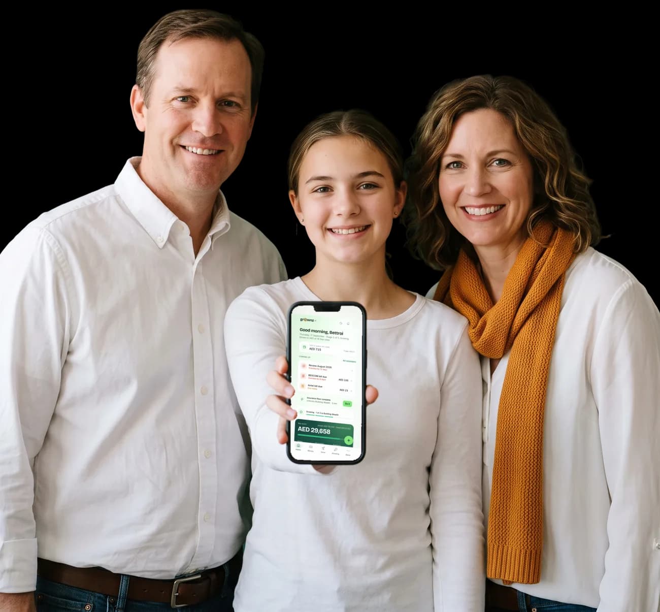 Two parents and a teenager, the teenager holding a phone up to the camera with the Grownz home screen showing